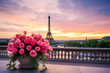 Eiffel Tower view from a glamourous terrace with sunset and flower pot.