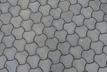 Background - Rounded Gray Concrete Interlocking Paver Blocks