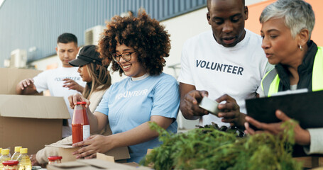 Wall Mural - Group of people, volunteer and checking food boxes on table for charity with care, kindness and help. Community donation, happy men and women at ngo with grocery checklist at non profit project event