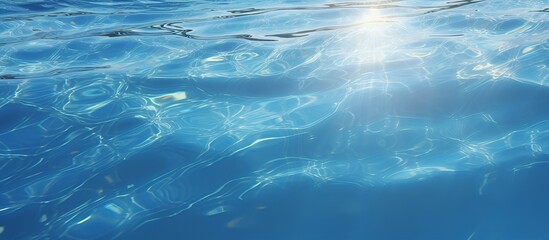 The smooth natural blue water background with bokeh abstract on the sea or ocean,vintage and soft colored blur