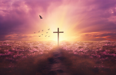 Wall Mural - Christian cross on a field during sunset with birds around it