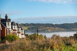 Fototapeta Londyn - Dorking, Surrey - UK: Early morning low cloud below Box Hill viewed from Cotmandene in Dorking, a picturesque town in the Surrey Hills