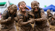 Mud-covered participants enjoying Boryeong Mud Festival, South Korea.