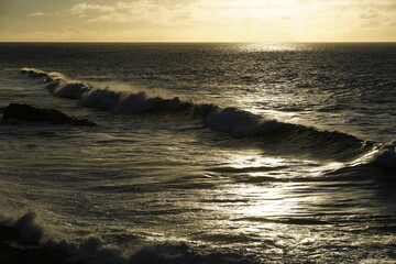 Sticker - effects of waves and the ocean on the coast at sunset