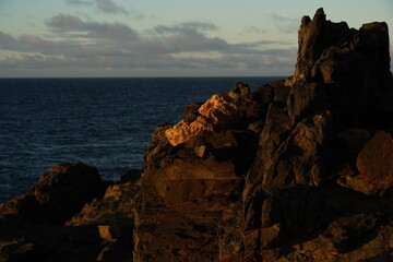 Sticker - effects of waves and the ocean on the coast at sunset