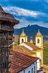 Wall Mural - Historic baroque church in the city of Ouro Preto in Minas Gerais, with the mountains in the background