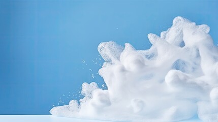 Poster - Fine White Foam Soap Suds Flowing on Blue Background Close-up View, Copy Space.
