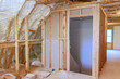 © ungvar - Spray foam insulation is used to insulate wall of an under construction site new home