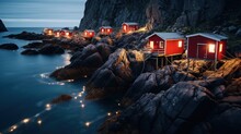 Traditional Red Rorbu Fisherman's Huts On The Rocky Coastline Of Lofoten Islands, Norway.