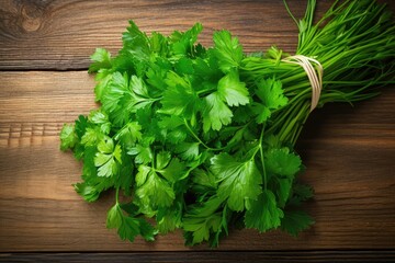 Wall Mural - Top view of organic Italian parsley bunch on rustic wood table background.