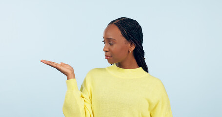 Poster - Woman, palm and advertising space in studio of announcement, mockup or promotion on blue background. African model show hand for presentation of choice, decision or feedback of deal, opinion or offer