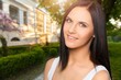 © BillionPhotos.com - Portrait of smiling young woman posing outdoor