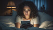 Woman in bed looking at a no reply text message with mixed feelings.