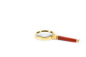 Wall Mural - Magnifying glass. Magnifying glass with gold-plated handle. On a white background.