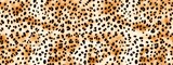 Seamless soft fluffy leopard print, cheetah spots African safari wildlife camouflage pattern. Realistic golden brown long pile animal skin rug, fur coat fashion background texture