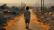 petit garçon vue de dos sur un chemin dans un paysage désolé de ruines