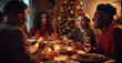 © Gianluca Lubrano - Friends of various ethnicities enjoying a joyful Christmas dinner together at home