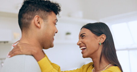 Canvas Print - Happy, couple is dancing in kitchen and hug for love with affection, bonding and romantic date at home. Fun, interracial people and commitment, loyalty and respect in healthy relationship with laugh