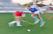 © Lumeez Ismail/peopleimages.com - Hockey, women and sports speed on field for athlete team playing in competition tournament. Fitness, ground and workout of girl sport people playing outdoor stadium game with motion blur.
