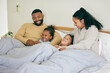 Happy family, wake up and playing in bed in the morning, bond and having fun in their home together. Love, bedroom and parents with children and tickle, game and laugh, play and cuddle on the weekend