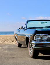 Restored Old Convertible Car At The Beach