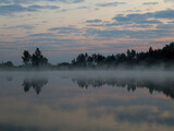 Fototapeta Natura - Fog over the lake in the morning. Sunrise.