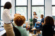 © alvaro - Asian woman talking during a relaxed meeting on a coworking