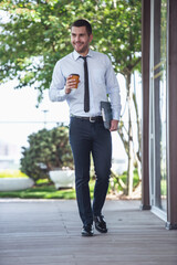 Wall Mural - Businessman walking outdoors