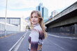 © Wesley JvR/peopleimages.com - Portrait of gen z city girl, natural beauty and standing on asphalt road with confidence, woman empowerment and self love. Skincare, pride or relax young person walking in urban San Francisco street