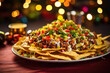 A festive plate of Christmas nachos, made from using leftover meat, beans, and vegetables from holiday dinner dishes, all topped with melted cheese and homemade salsa.