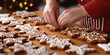 Closeup of a skilled baker meticulously icing and decorating dozens of gingerbread cookies to be sold at a holiday market.