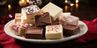 A tray of holiday fudge, featuring a wide range of textures from smooth and creamy to slightly grainy, with flavors like chocolate, peppermint, and eggnog.