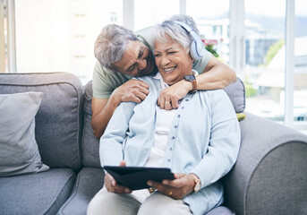 Canvas Print - Laughing, hug and couple with a tablet for a website, streaming music or a podcast together. Love, embrace and a senior man and woman with a movie or funny video on technology or listening to audio