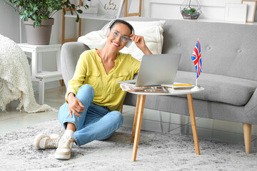 Poster - Mature woman with laptop studying English online at home