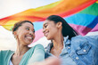 © Charlize D/peopleimages.com - Happy couple, lesbian with women in selfie, pride flag and lgbt relationship with love and happiness. Female people smile in picture, gen z youth and gay equality, support and trust with partner