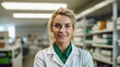 © seesulaijular - Pharmacist, white woman, blond hair, white apron. Light green shirt underneath, smiling slightly, confidence in his eyes.