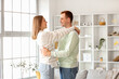 © Pixel-Shot - Happy young couple dancing at home