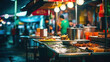 © Sasint - abstract image of food stall at night market festival for background usage