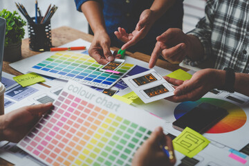 Web creative team Graphic designer planning for mobile phone choose color template draw app website ux ui for mobile application and development model Prototype outline development process.