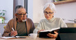 © Charlize D/peopleimages.com - Senior couple, bible study and home with reading, writing and thinking with faith, worship or knowledge. Elderly woman, old man and interracial marriage with religion, notebook or spiritual education