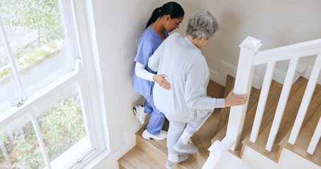 Canvas Print - Nurse, senior woman and support on stairs, help and walk in nursing home. Caregiver, assistance on steps and elderly patient with a disability, injury or sick in rehabilitation for medical healthcare