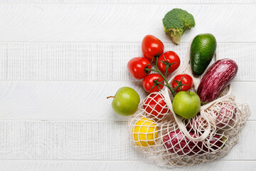 Wall Mural - Mesh bag filled with a variety of vegetables