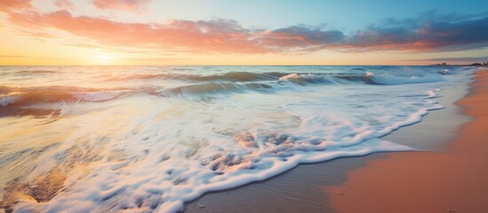 Wall Mural - After the storm the shoreline of the Baltic Sea is adorned with the remnants of crashing waves and splashes As the sun sets casting a soft golden light the water s surface texture becomes a 
