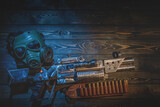 Fototapeta  - Sci fi post apocalypse pump shotgun and gas mask on the survivor table concept background.