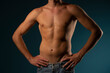 © vladimirfloyd - the torso of a young athletic guy. concept: the male body after exercise and diet. men's health: shaved breasts on a dark background