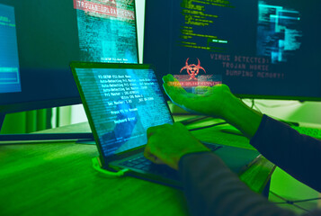 Fototapete - Cybersecurity, crime and hands of hacker with virus in neon office with code, fraud and danger. Software, ransomware and web programmer on cyber attack, password thief coding online scam and hacking.