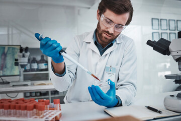 Science, petri dish and man scientist for healthcare research test, analysis or neurology study in laboratory. Focus medical worker, chemistry professional or expert with blood DNA sample for cancer