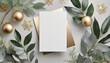 flat lay blank card mock up with Christmas leaves and gold ribbon