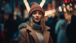 Woman wearing a coat in winter in a shopping street for christmas shopping, at night in the dark with unsharp streetlights