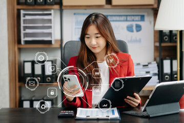  Businesswoman working with smart phone and laptop and digital tablet computer in office with digital marketing media in virtual icon